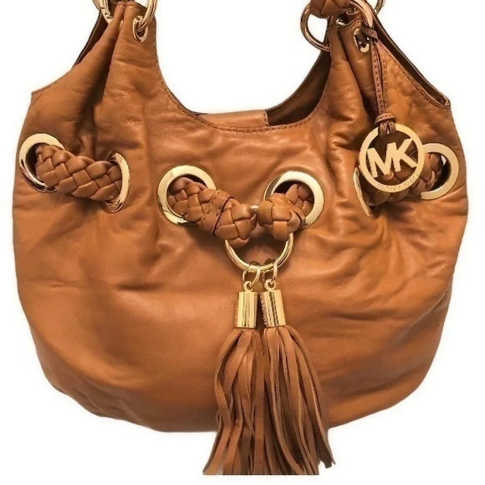 Michael kors brown leather grommet tassel bag